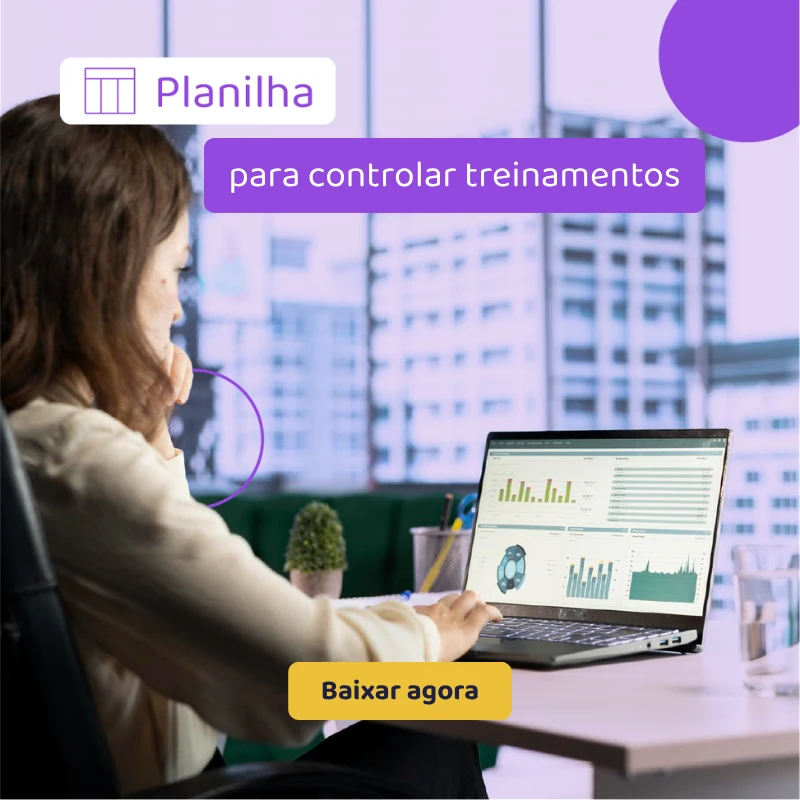 Mulher trabalhando em escritório com notebook exibindo gráficos e dashboard, enquanto usa um visual de 
